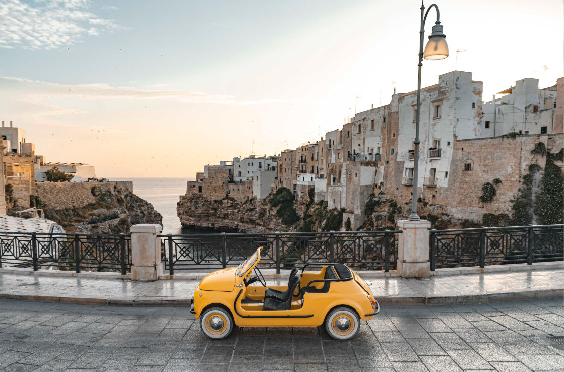 Side shot of the Fiat 500 Jolly Spiaggina in an old Italian town